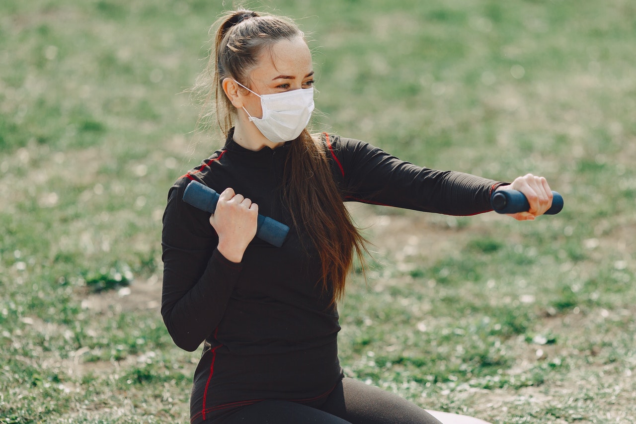 Woman working out in mask