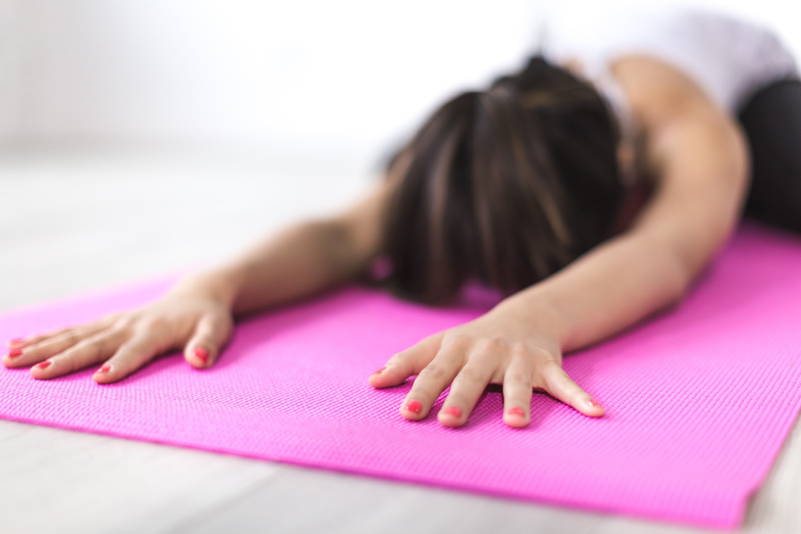 Woman stretching on a yoga mat